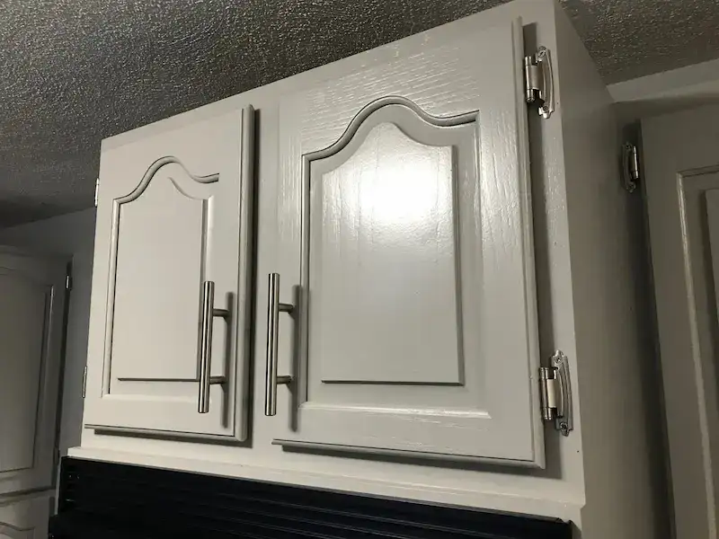 Freshly painted kitchen cabinet doors in Rhode Island after professional cabinet painting service.